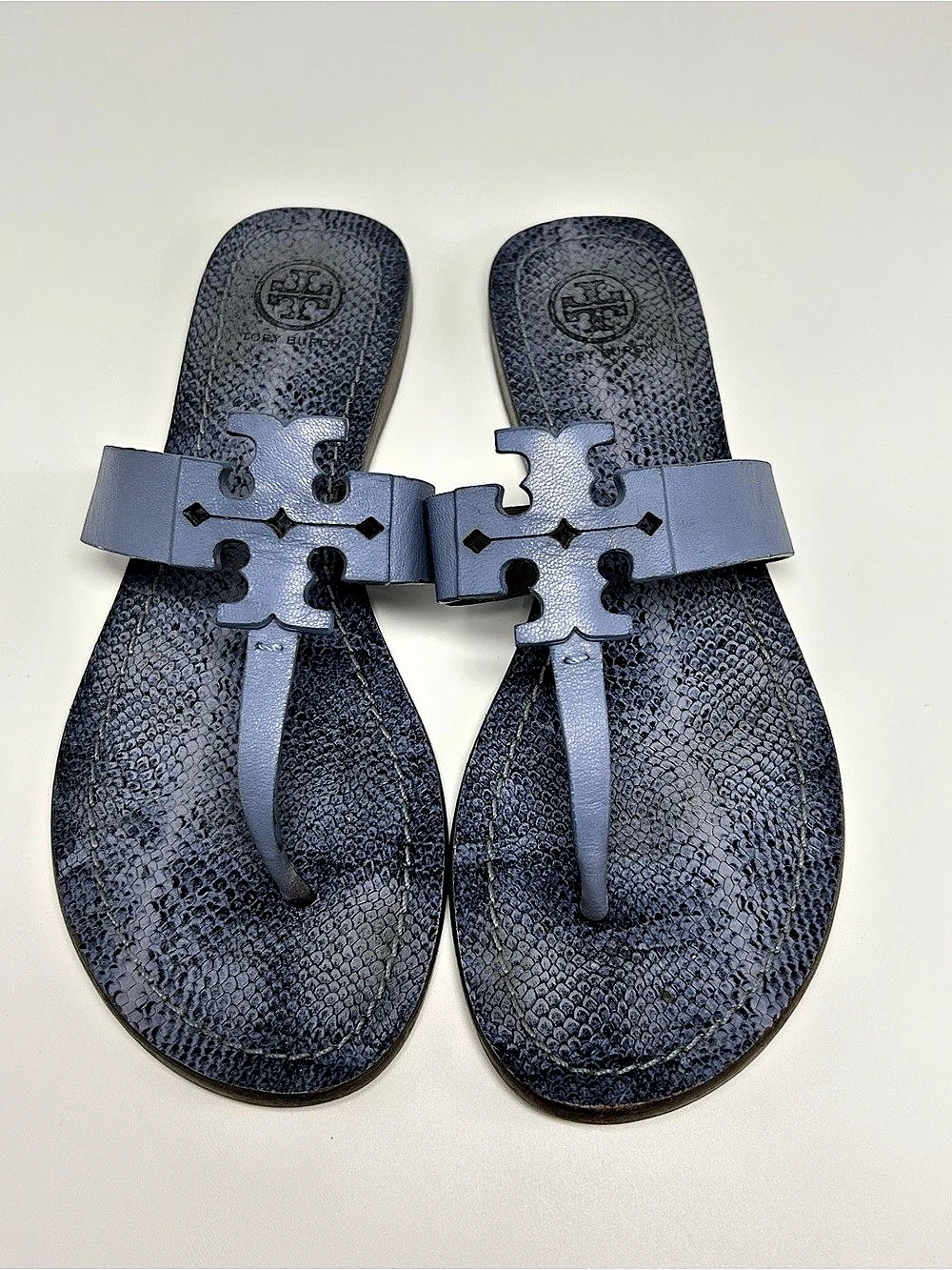 Tory Burch Moore Flat Thong Sandals in a blue snake-print leather. US 7.5